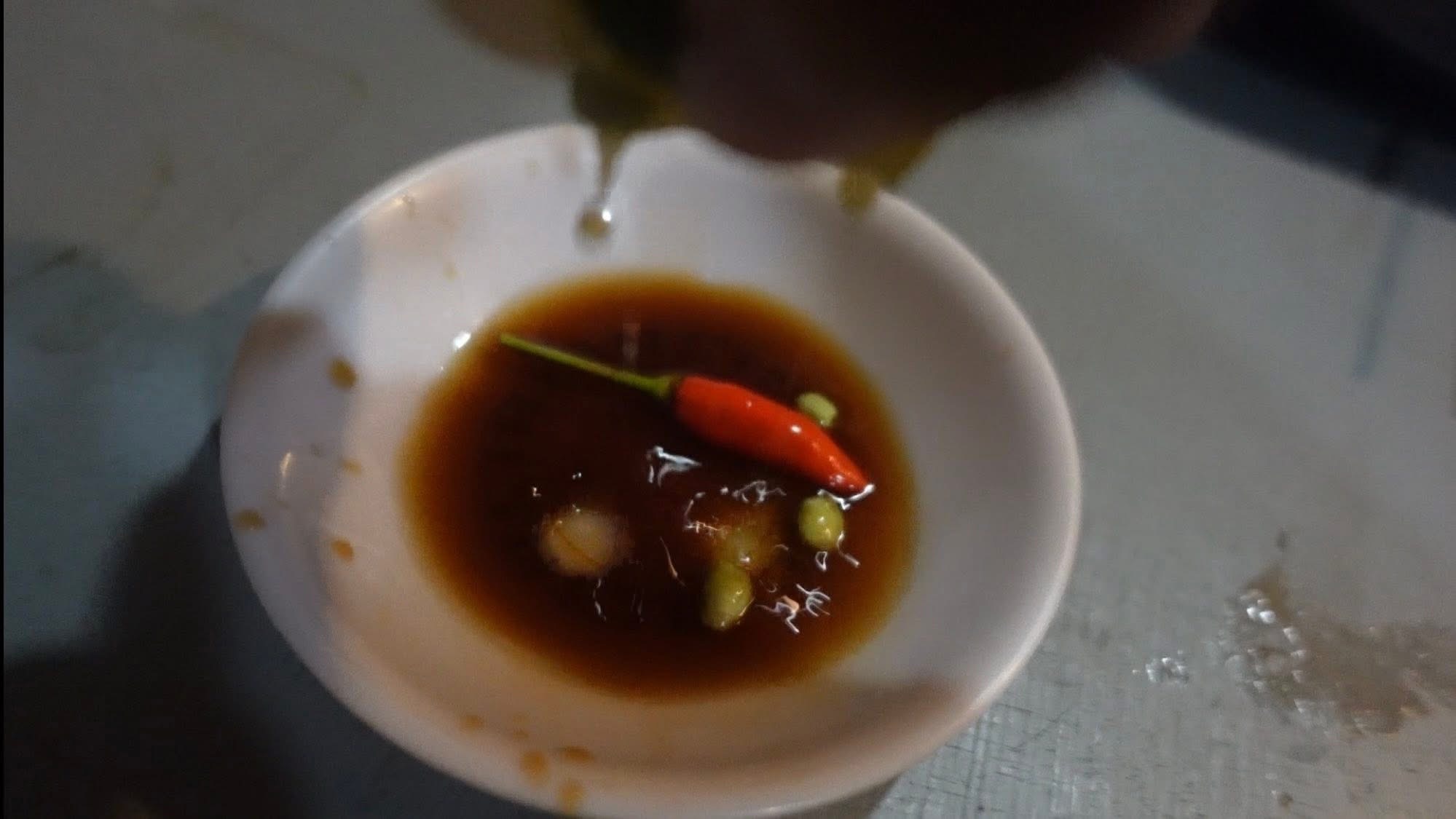 Adding Calamansi to the Sawsawan Sauce