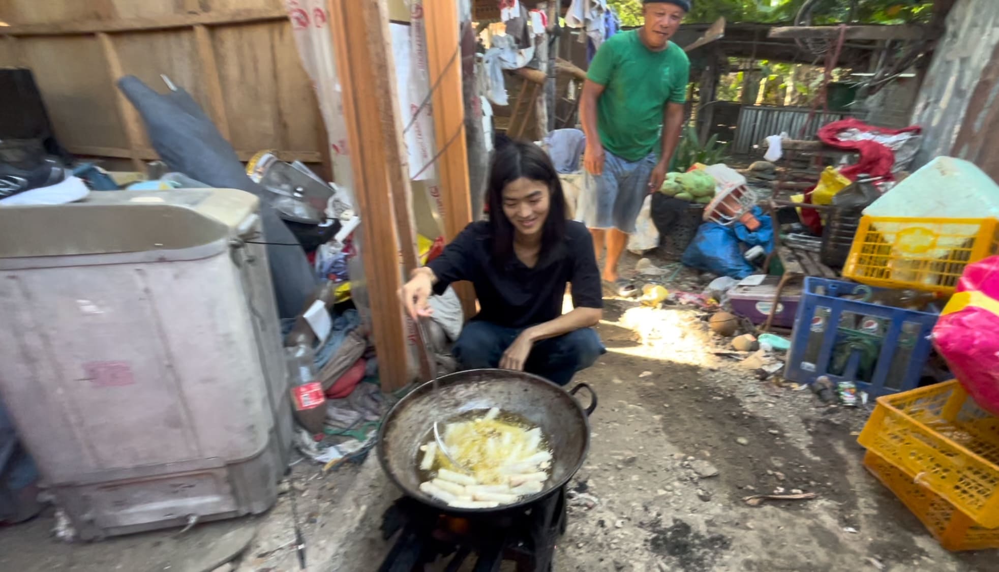 guy help cooking lumpia