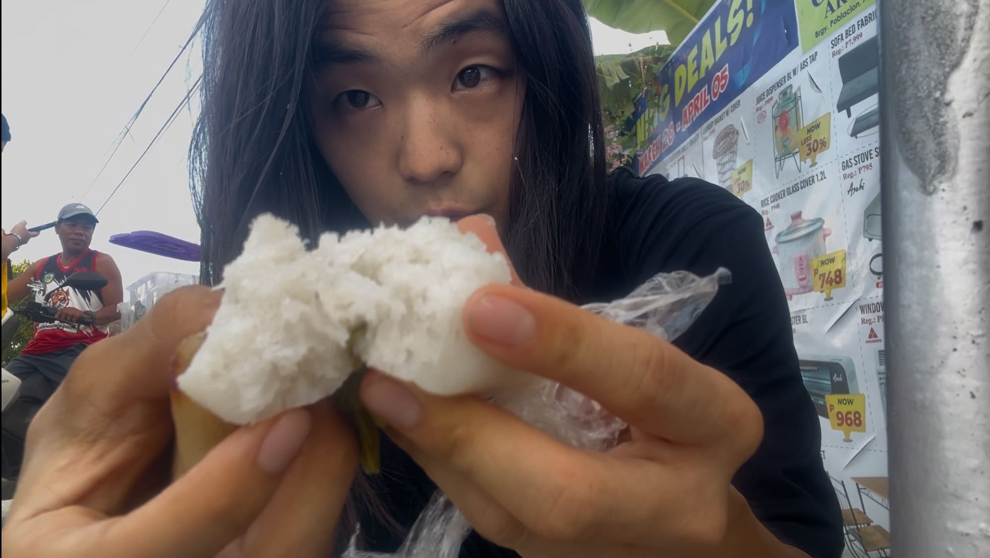 a guy holding white bibingka