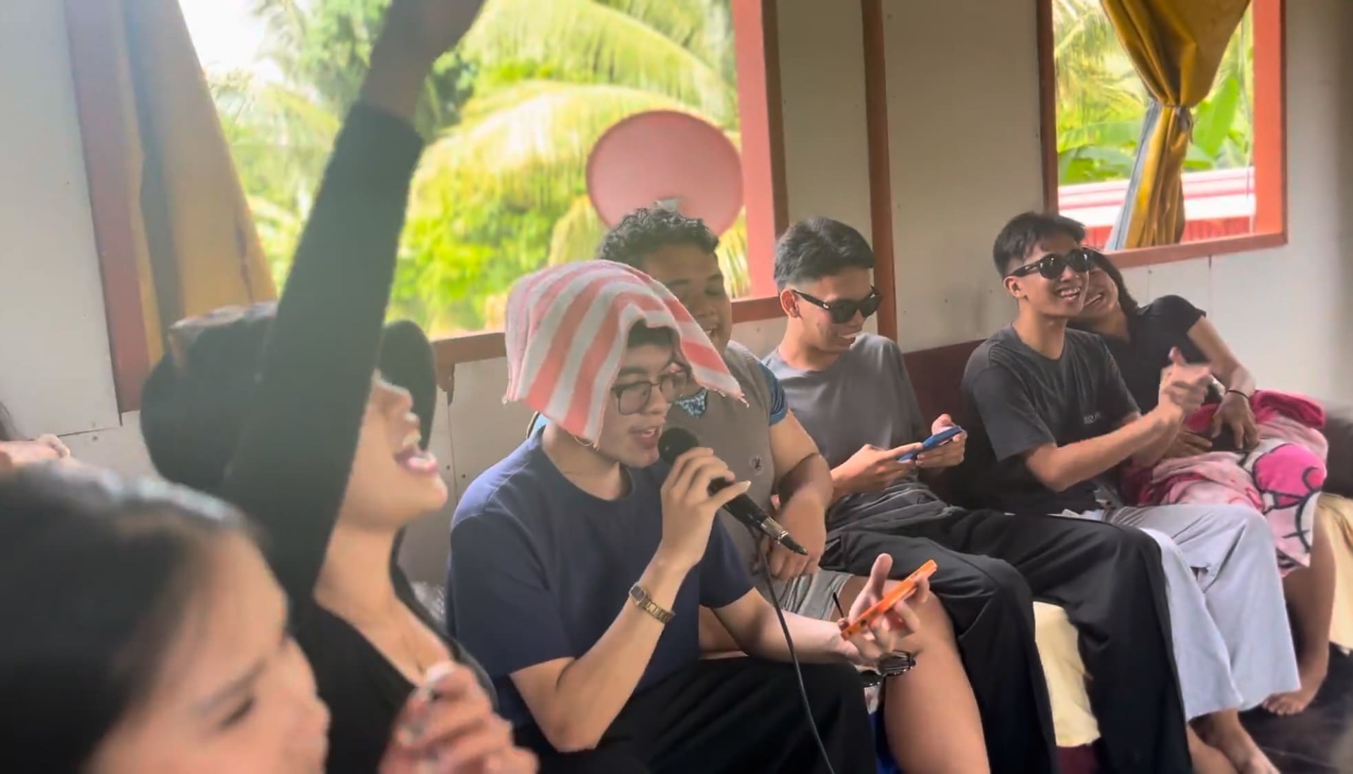 everyone enjoying videoke.