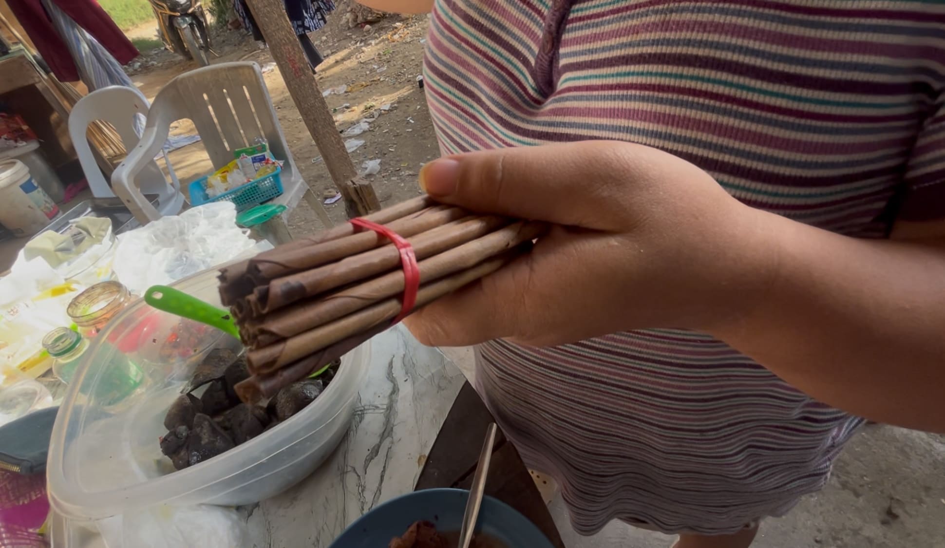 lomboy cigarette smoking hand-rolled leaf outdoors, organic alternative to tobacco or cannabis, smoke Lomboy (traditional Philippine hand-rolled... -
