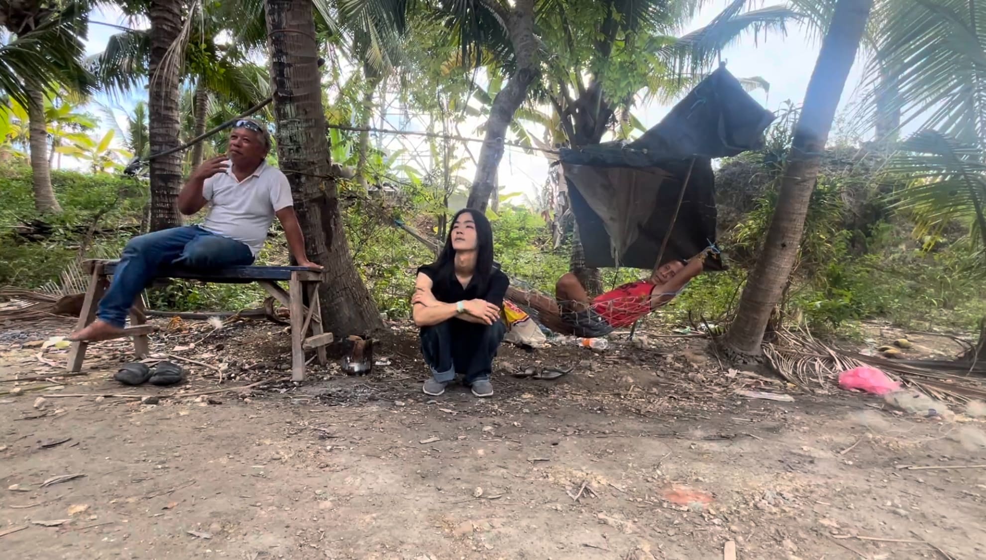 a japanese guy and two filipino men spending time outside in Argao