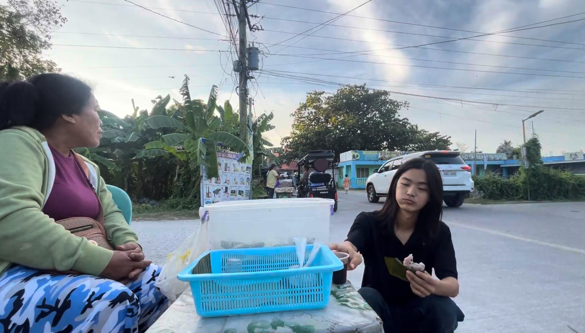 a guy eating puto in Argao, Cebu