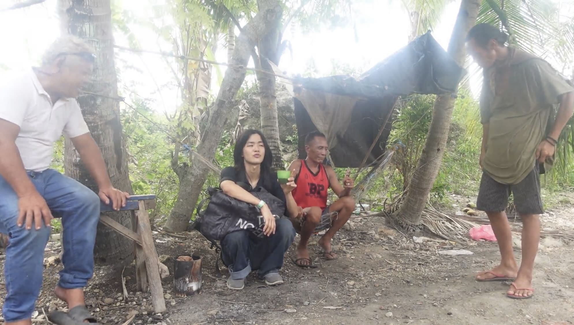 four men spending time outside in Argao and look relaxed