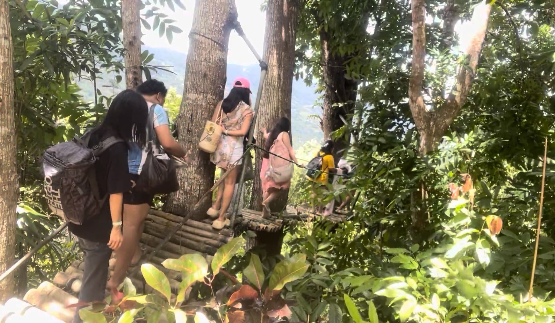 Crossing the bridge at Coal Mountain Resort, Argao