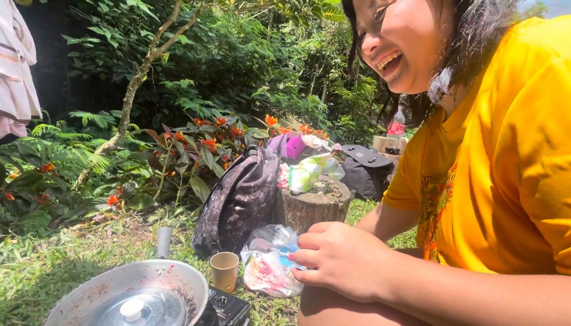 A filipino girl cooking with smile at Coal Mountain Resort, Argao