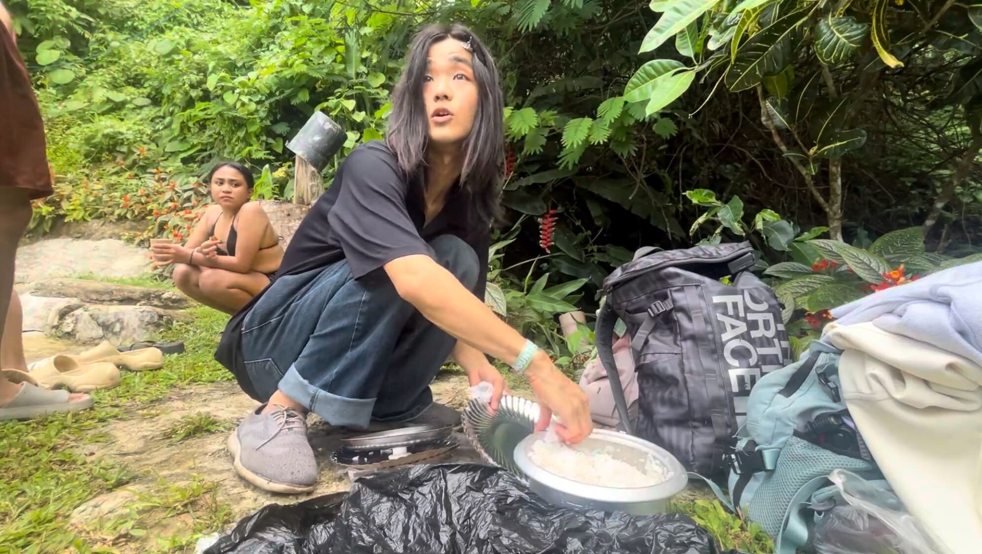 a guy trying to eat spoiled rice at Coal Mountain Resort, Argao