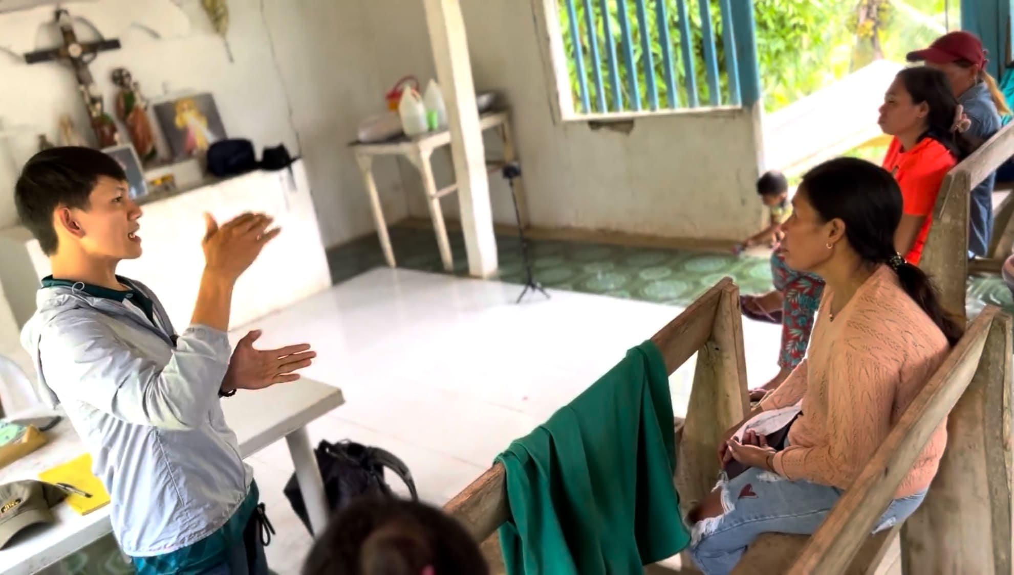 Man speaking to farmers during a Farmers' Association meeting in Catmon, Cebu