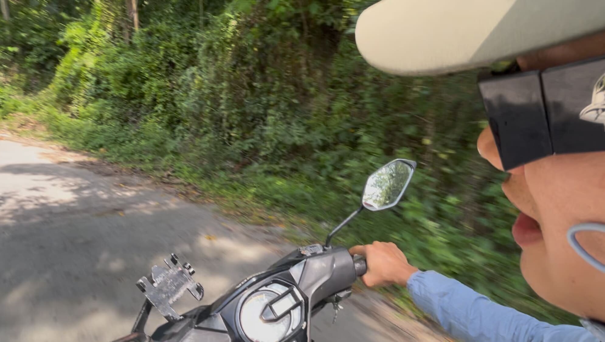 Melvin talking about farming while riding a motorcycle in Cebu, Philippines