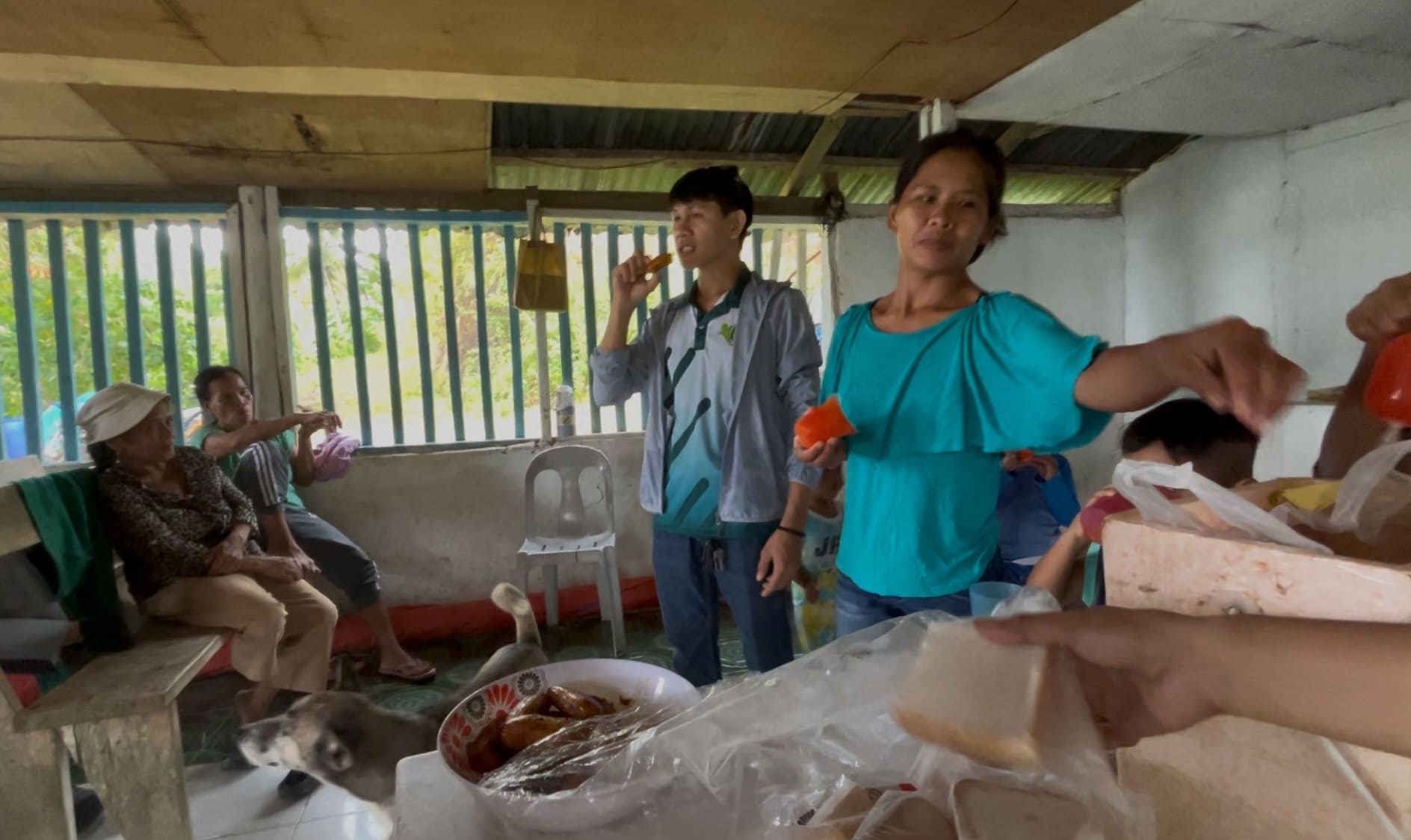 farmers sharing food and talking in a community gathering