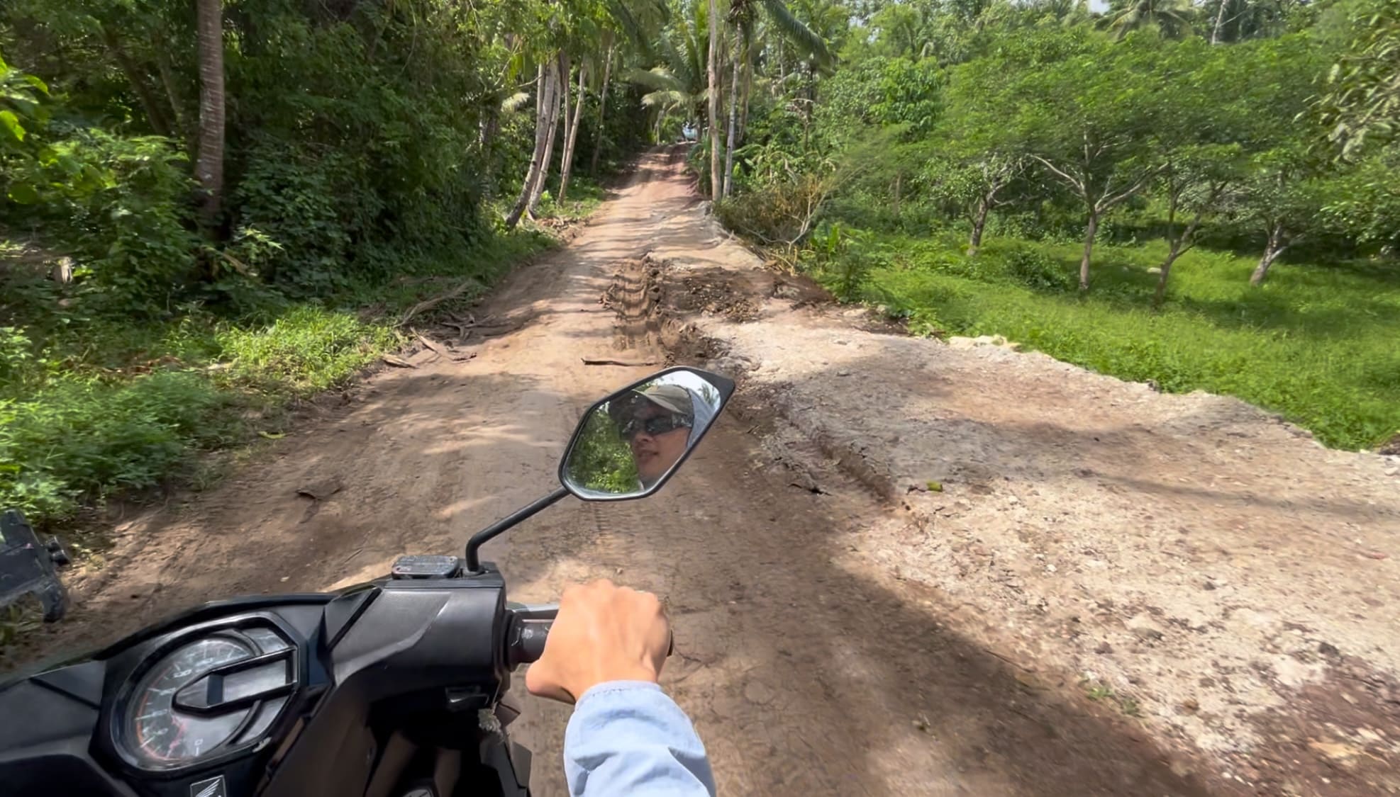 riding through a rough mountain road to Barangay Amancion