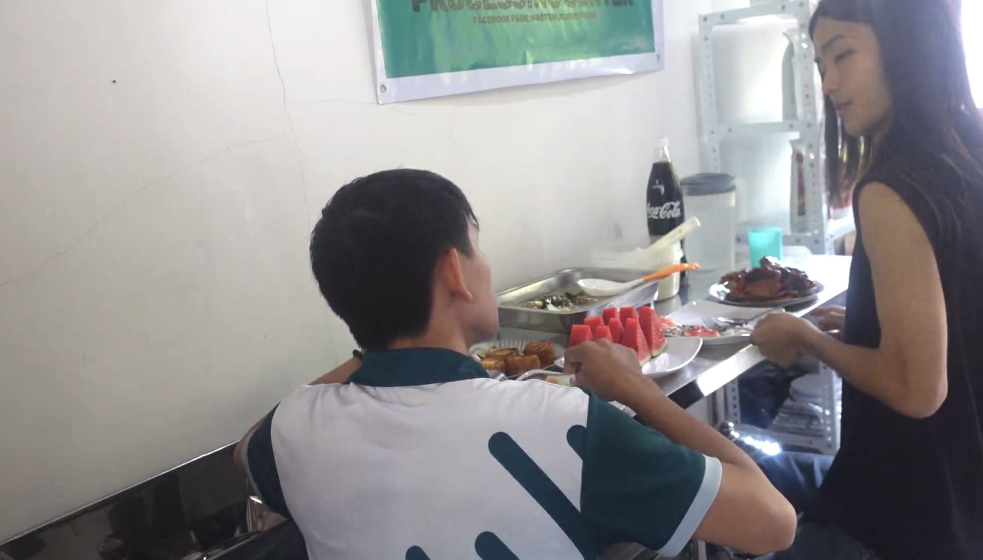 Two men having breakfast in a rural area of Catmon, Cebu