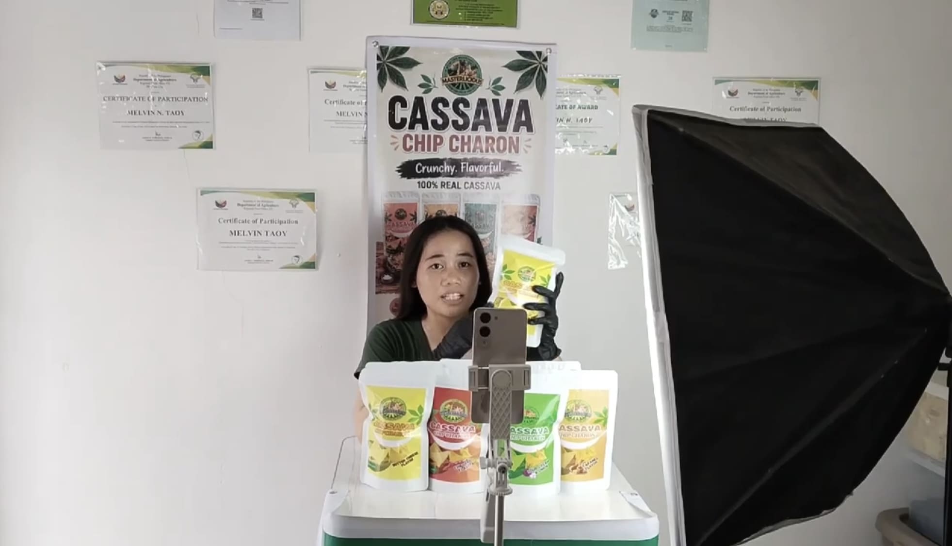 Woman selling packaged food products during a TikTok live stream