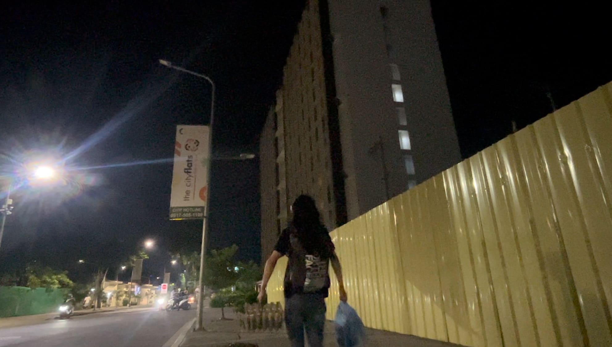 Man looking at the city lights in IT Park at night