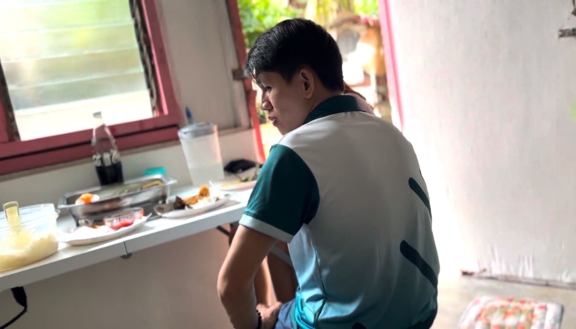 Man thinking during a conversation inside a food processing facility