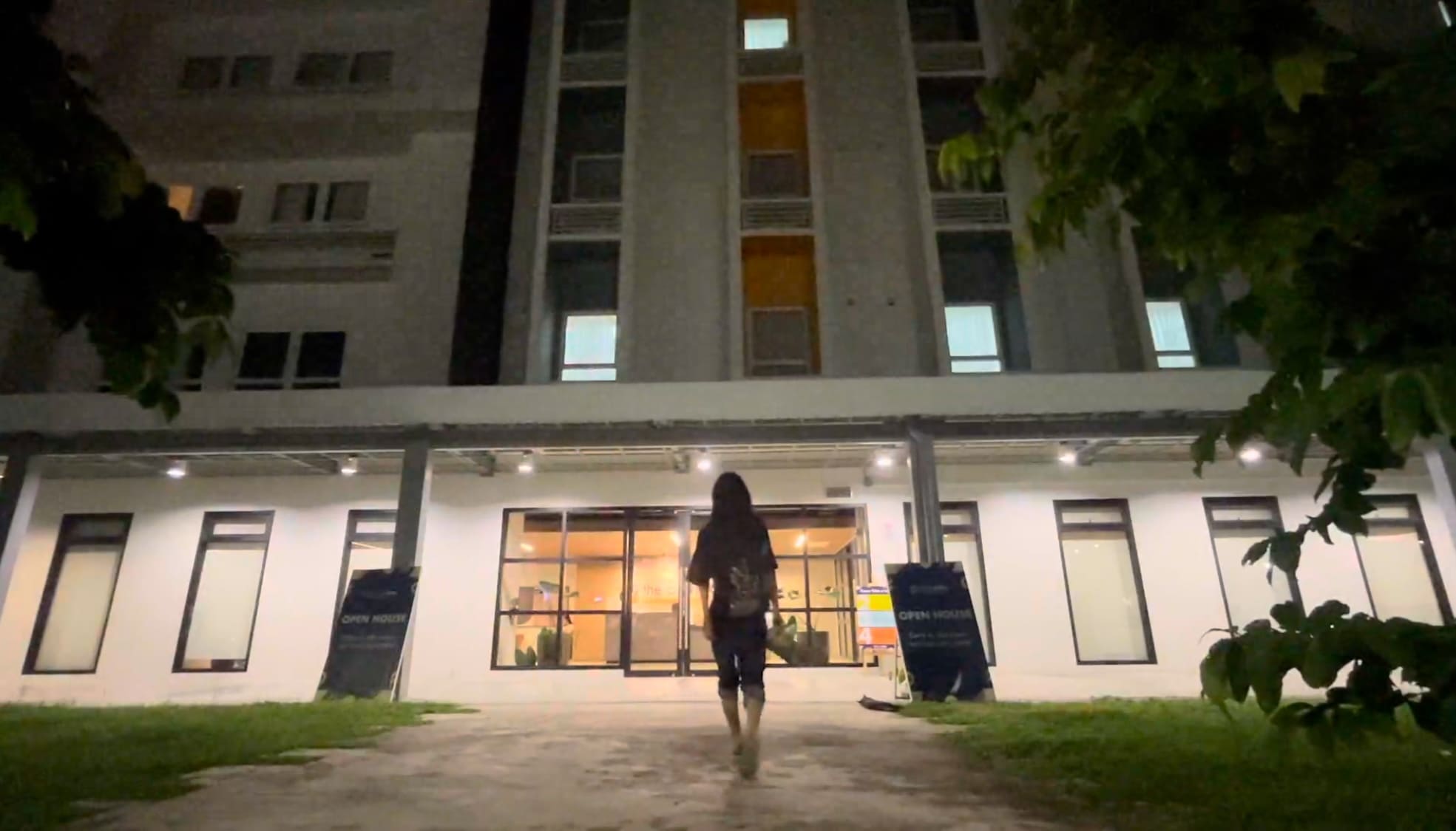 Man entering a building at night in IT Park