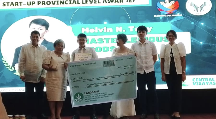 Man receiving a certificate at the Young Farmers Challenge Batch 2024 Awarding Ceremony