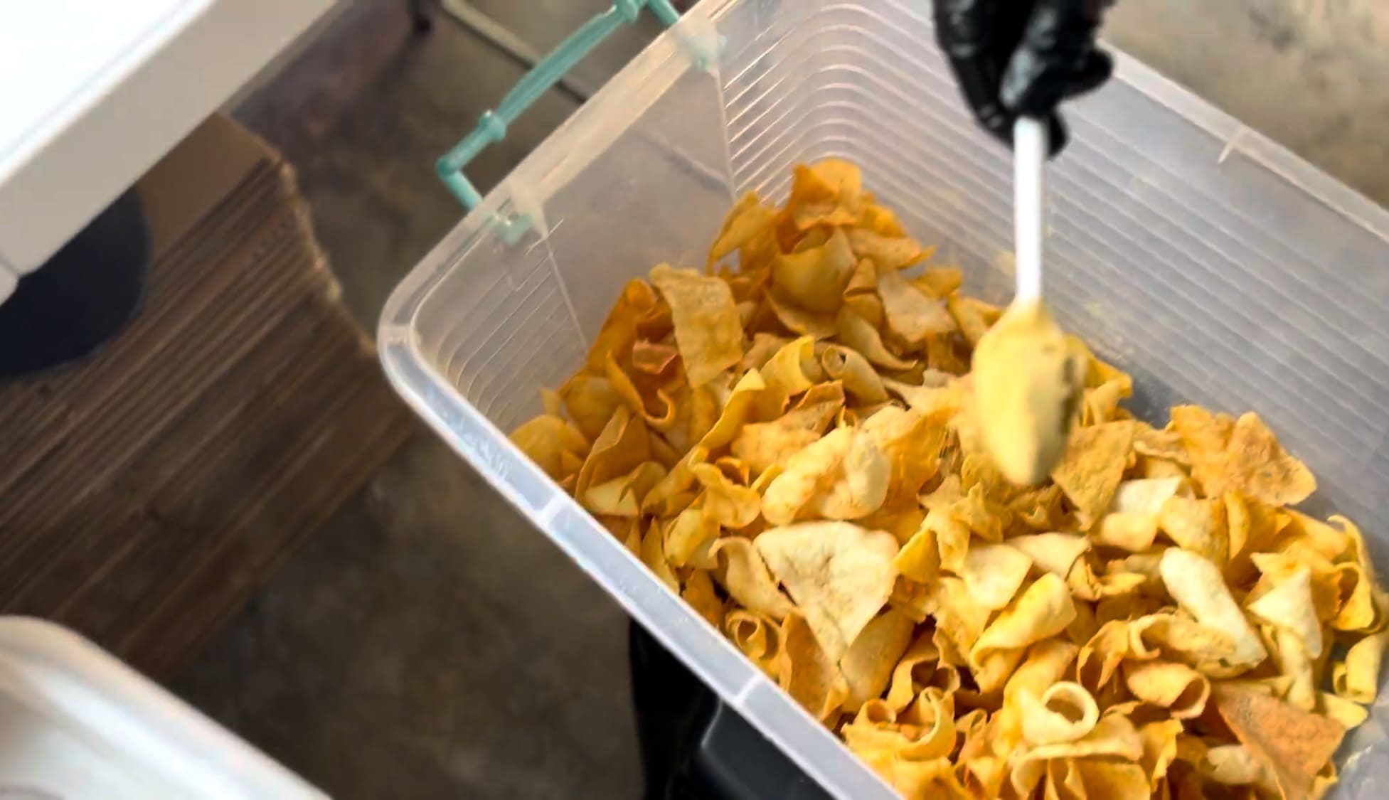 Cassava chips being seasoned during processing