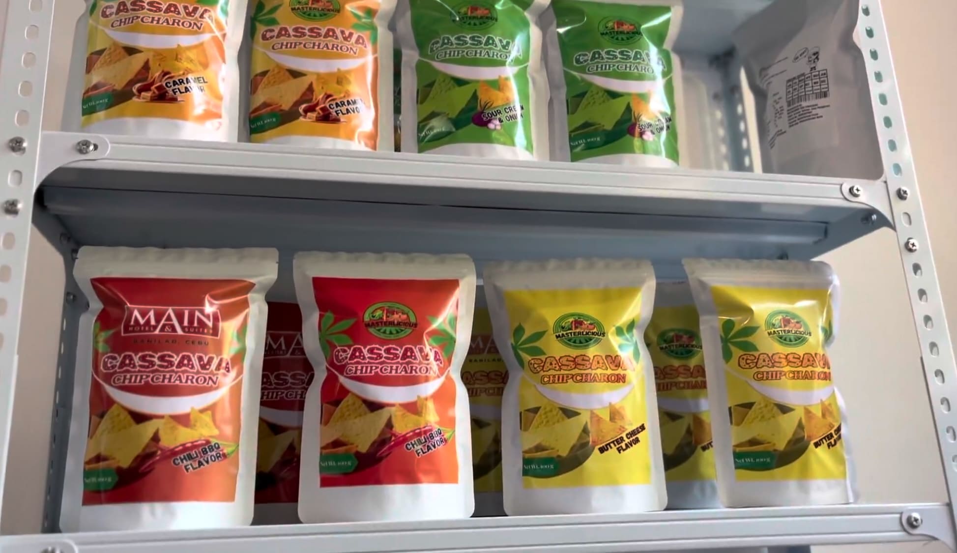 Cassava chips displayed on shelves inside a small food business