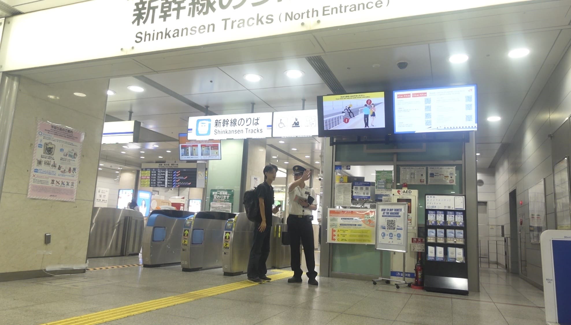 Man asking a station staff member a question