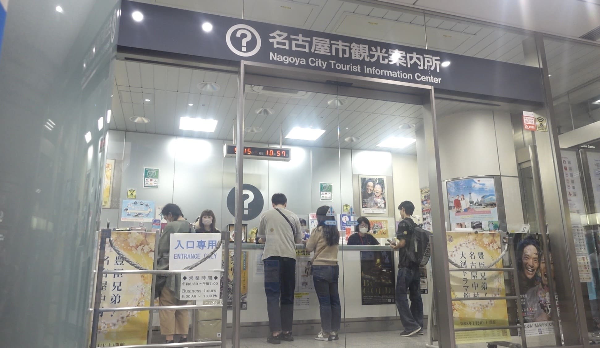 Man asking a question at a tourist information center