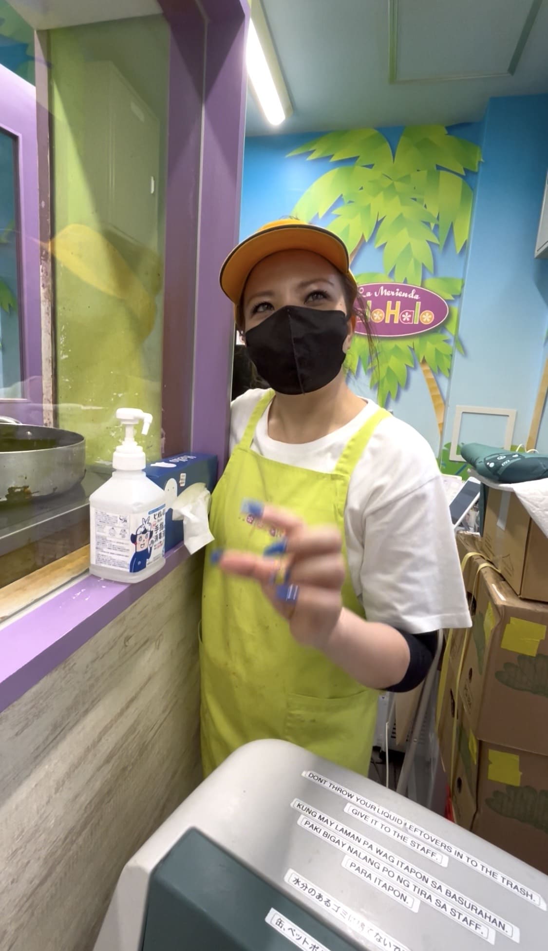 Filipino woman smiling inside a halo-halo shop