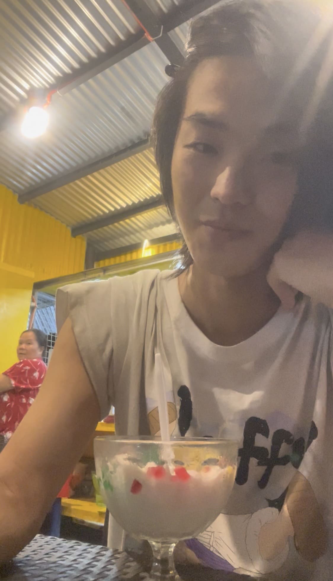 Man eating halo-halo at a local food stall in Cebu