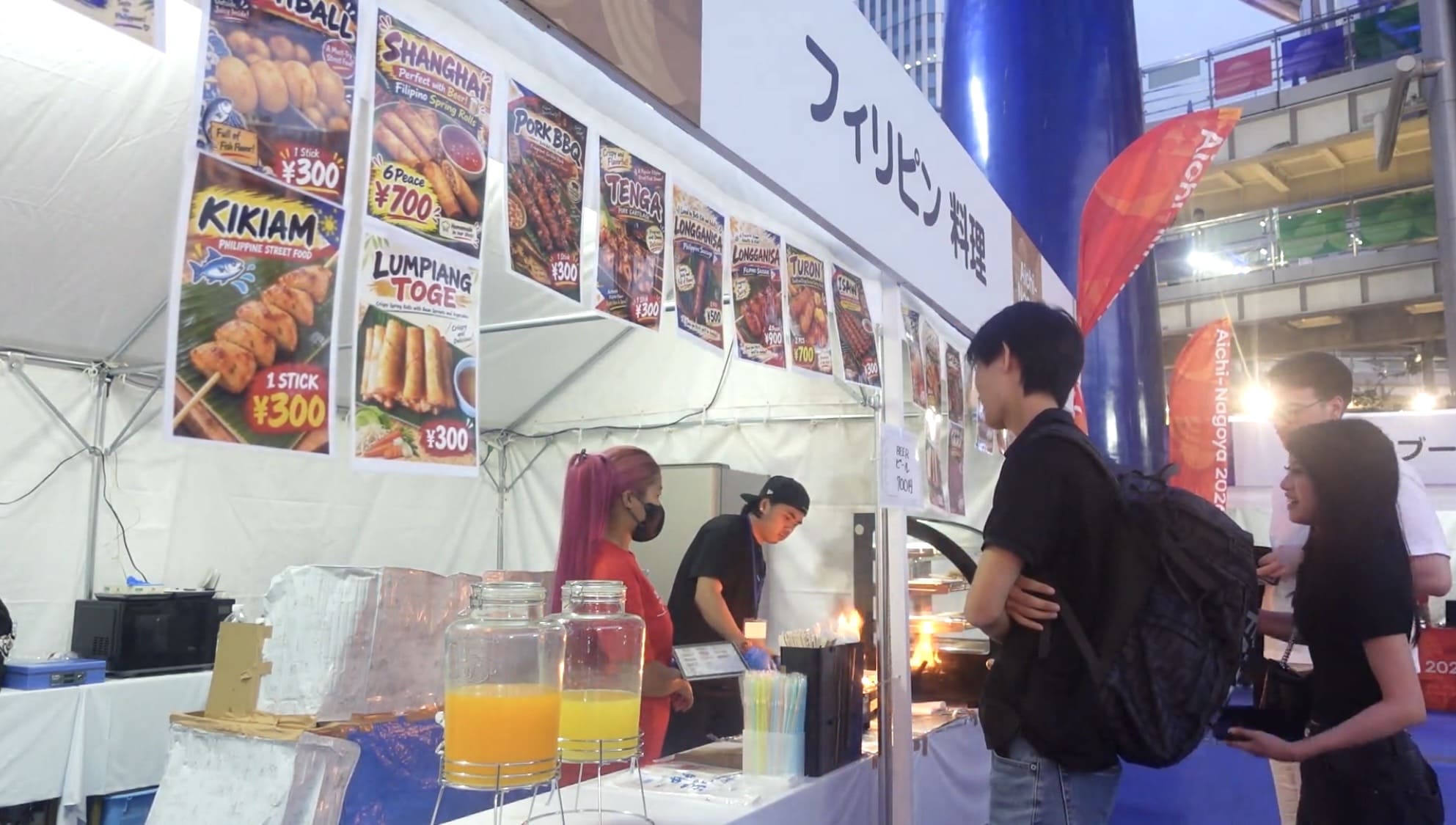 Filipino food booth with customers at Oasis 21