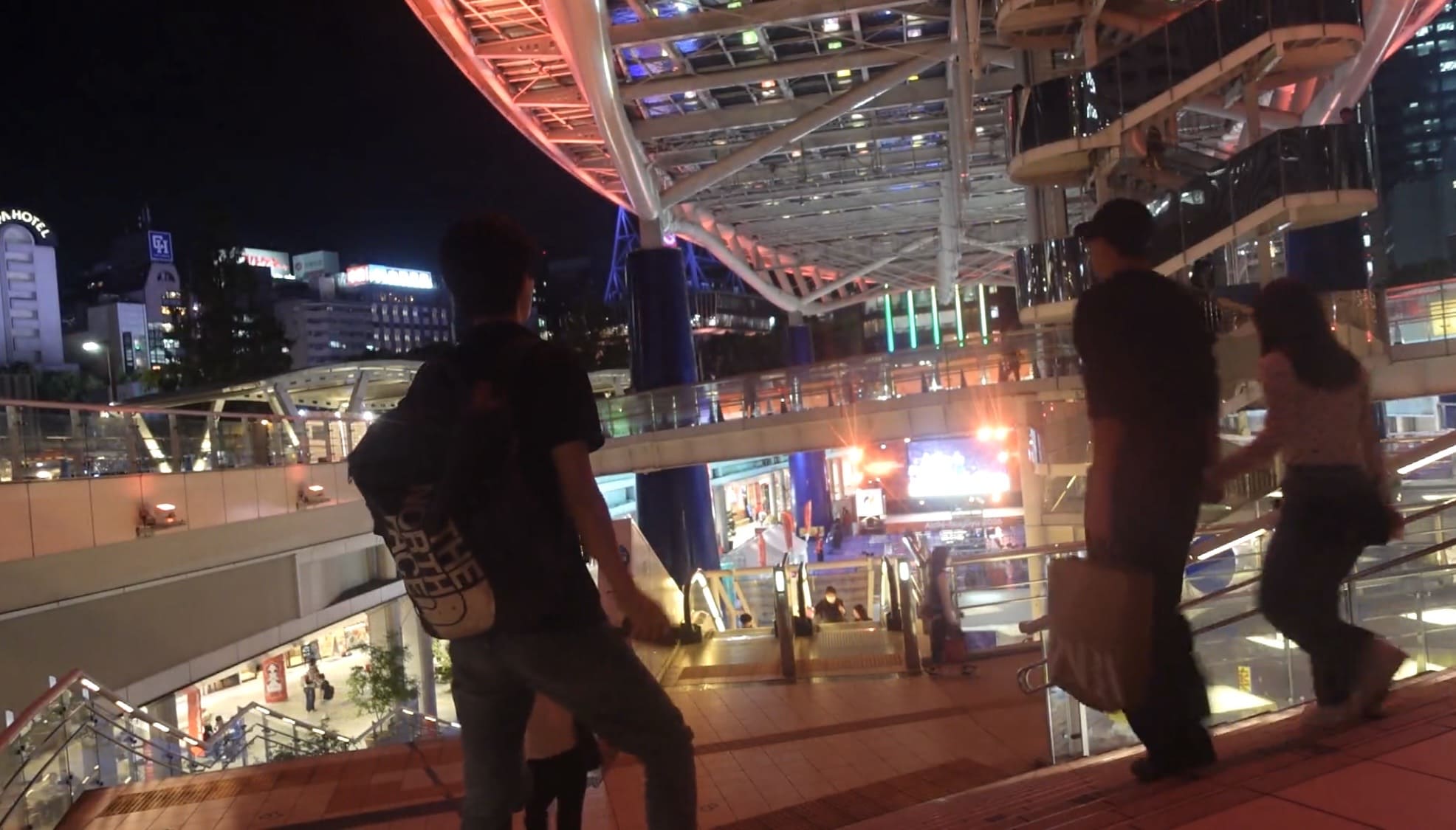 Man looking down at the stage from the Oasis 21 venue after leaving the event