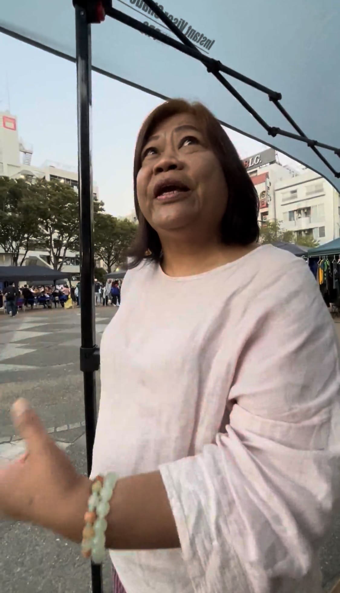 Filipino woman speaking passionately during an interview