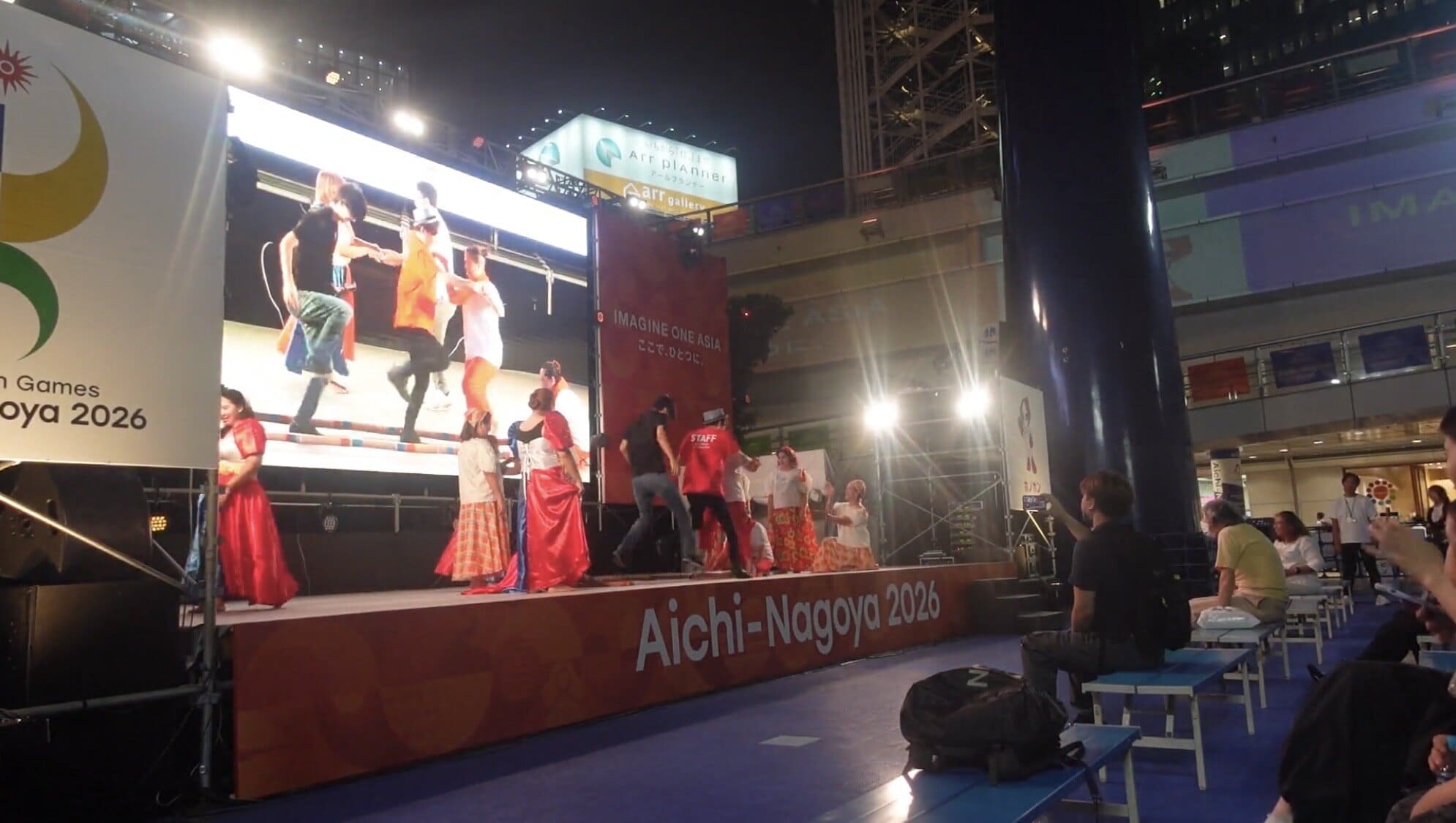 People taking part in a traditional Filipino bamboo dance in Nagoya, Japan