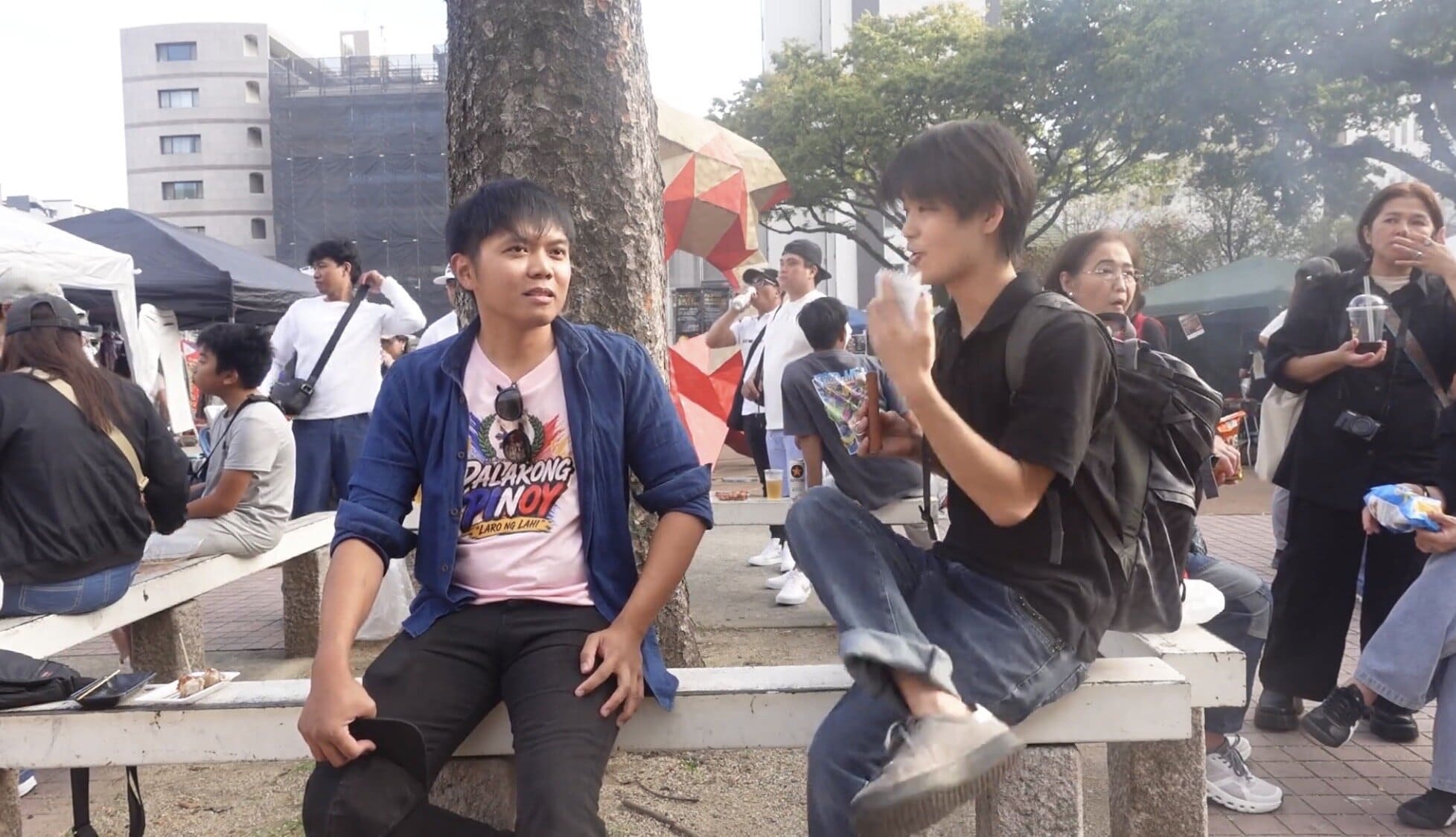 A Japanese man talking with a Filipino truck driver in Japan