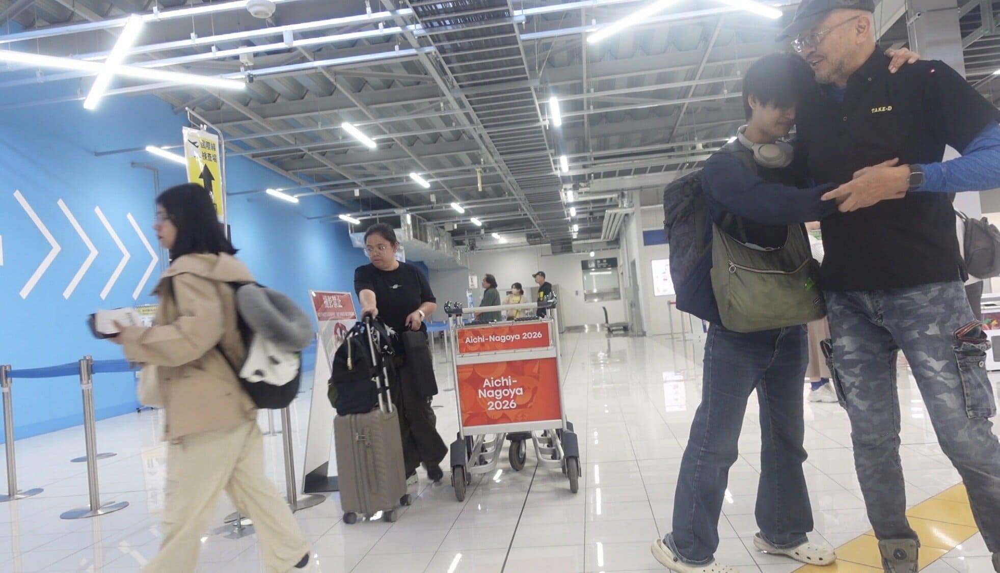 A man hugging his father goodbye before leaving Nagoya, Japan